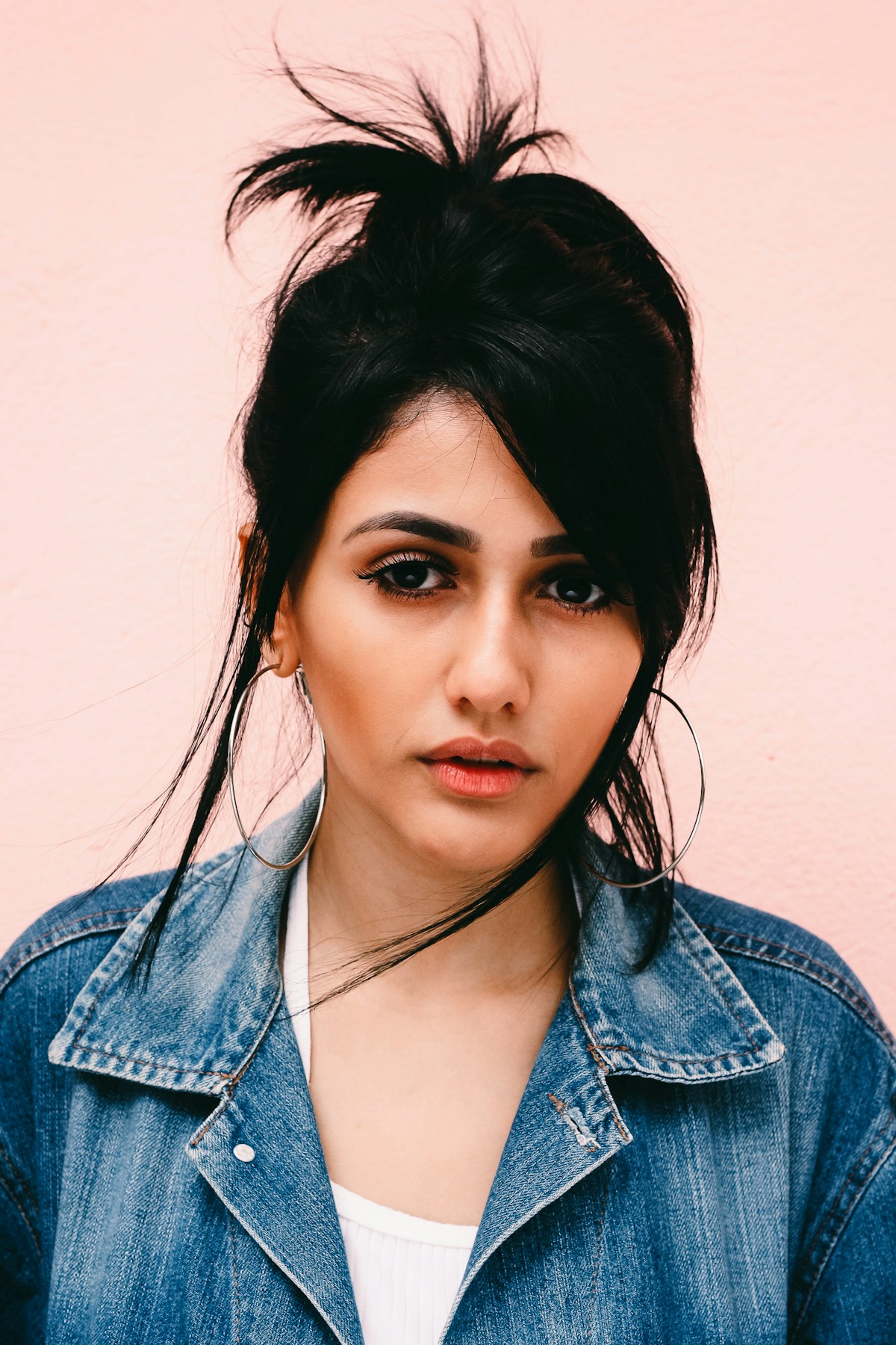 Temporary example portrait of a woman clearly wearing large hoop earrings.